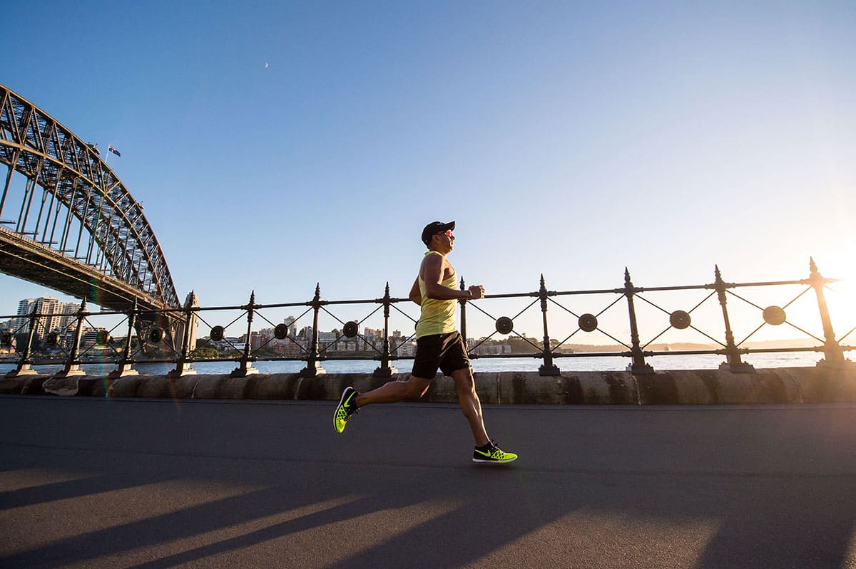 Premium Photo | A poster for a marathon with a woman running in the  background