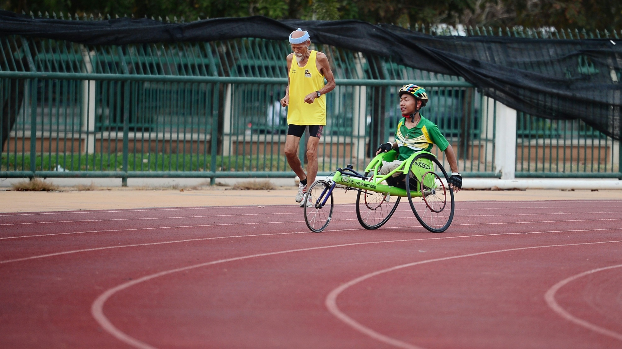 World Olympic & Paralympic Day, man on a wheelchair for a race.