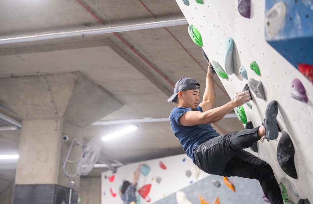 man on climbing wall at the climbing district's tottenham hale venue